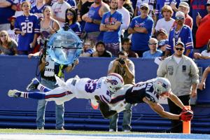 Buffalo Bills free safety Aaron Williams (23) tackles New England Patriots wide receiver Julian Edelman (11) in the end zone during the second half of an NFL football game Sunday, Sept. 20, 2015, in Orchard Park, N.Y. Williams was injured on the play as Edelman scored. (AP Photo/Bill Wippert)