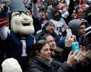 New England Patriots mascot Pat Patriot, and fans cheer during an NFL football send-off rally at City Hall in Boston (AP Photo/Charles Krupa)