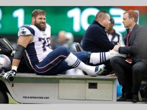 Sebastian Vollmer (76) is carted off the field during the first half (AP Photo/Kathy Willens)